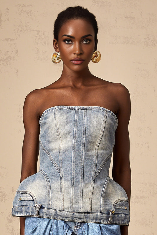 Woman wearing a blue offshoulder denim top with a relaxed fit