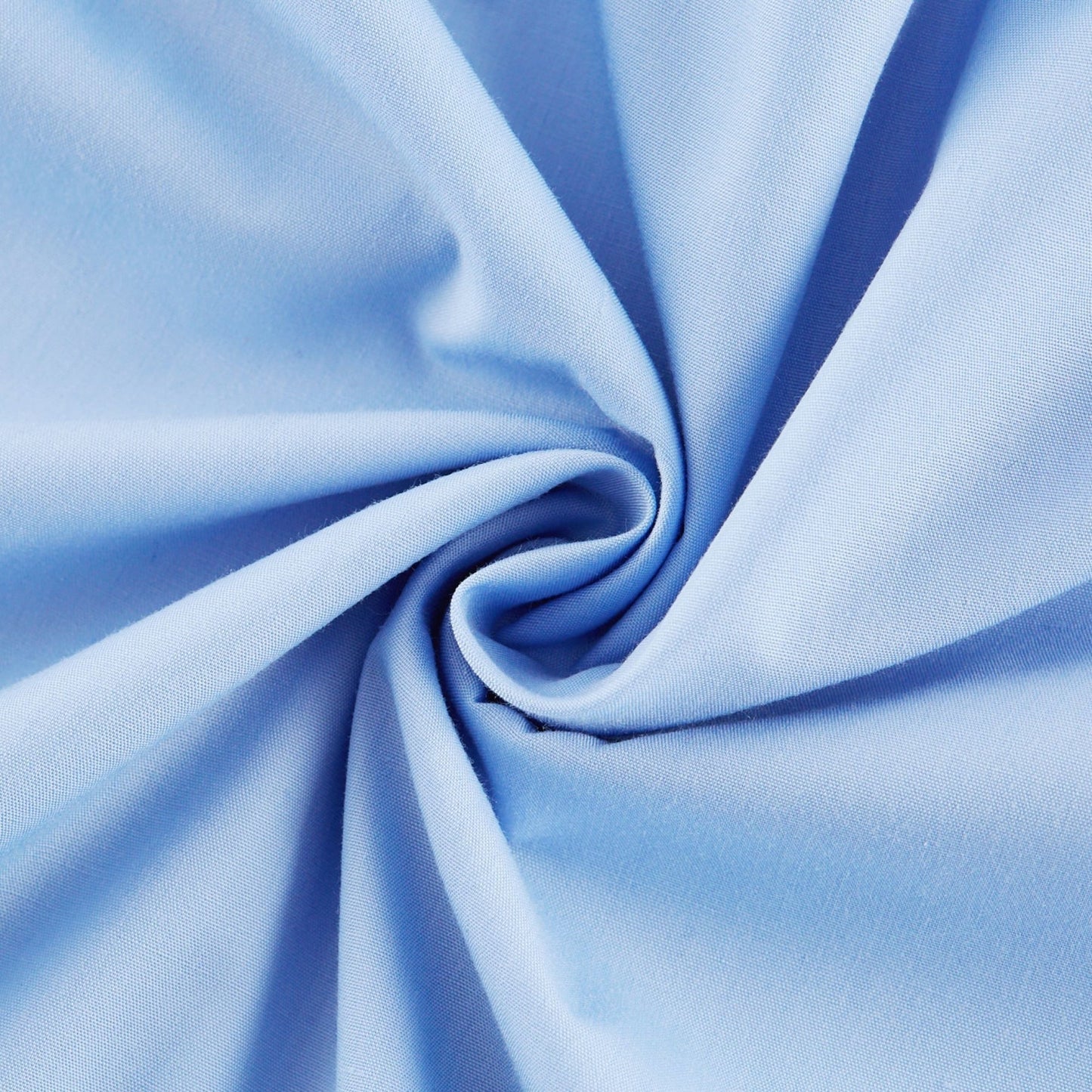 Woman wearing a blue offshoulder tiered midi dress with flowy fabric standing against a plain background