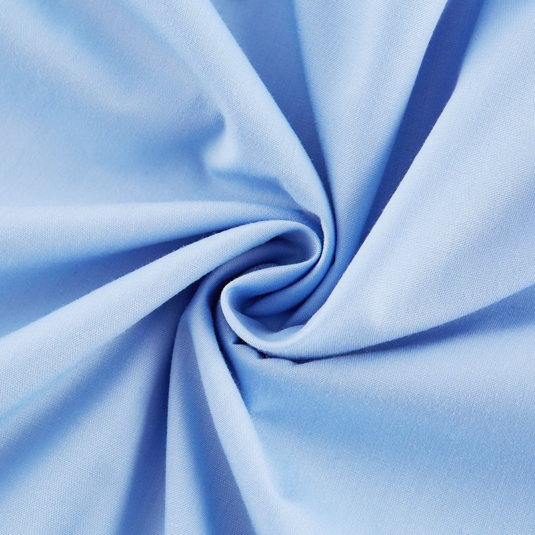 Woman wearing a blue offshoulder tiered midi dress with flowy fabric standing against a plain background