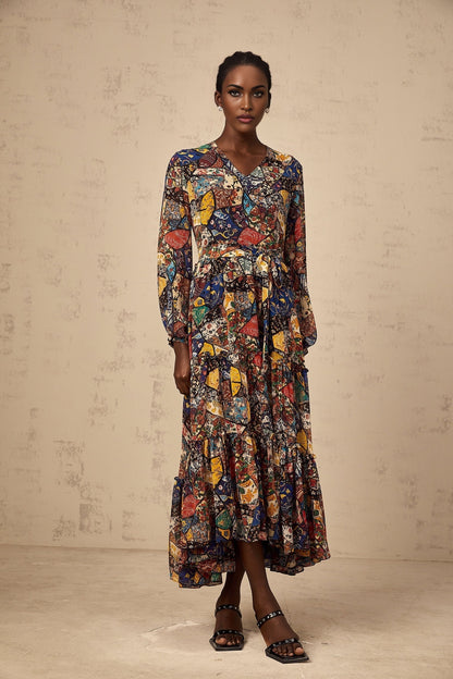 Woman wearing a brown bohemian style midi dress with shirring detail