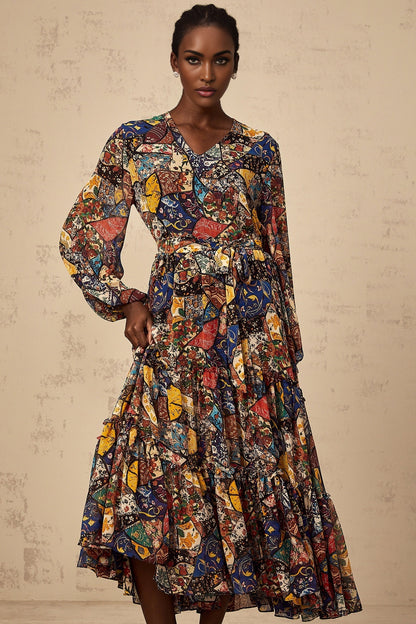 Woman wearing a brown bohemian style midi dress with shirring details and flowing fabric