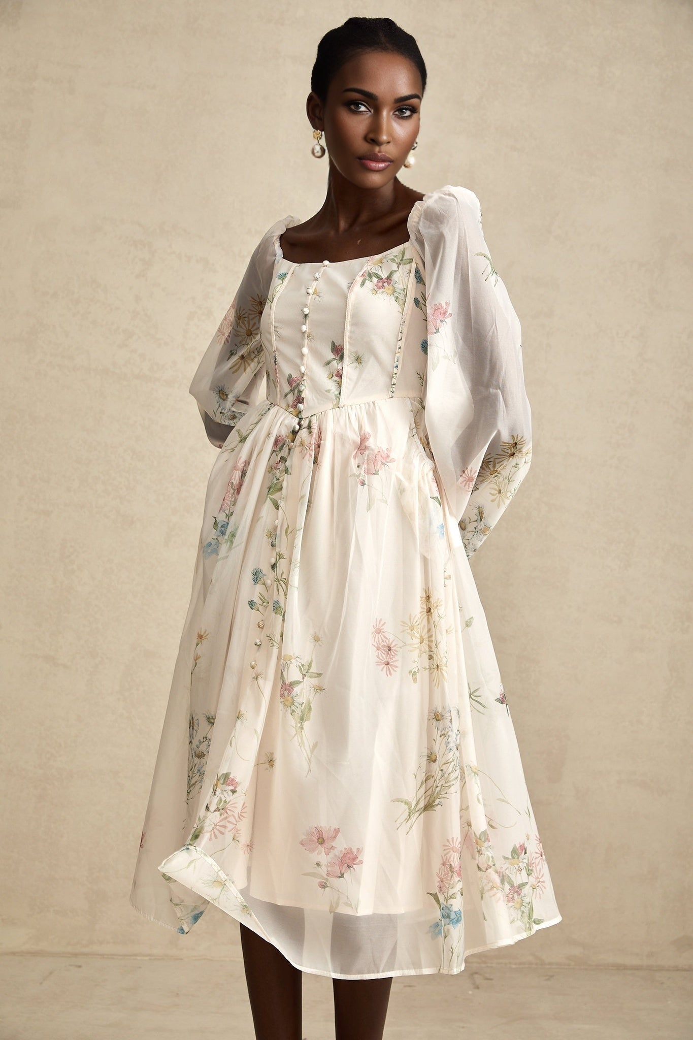 Woman wearing a floral print midi dress with square neckline named Anne