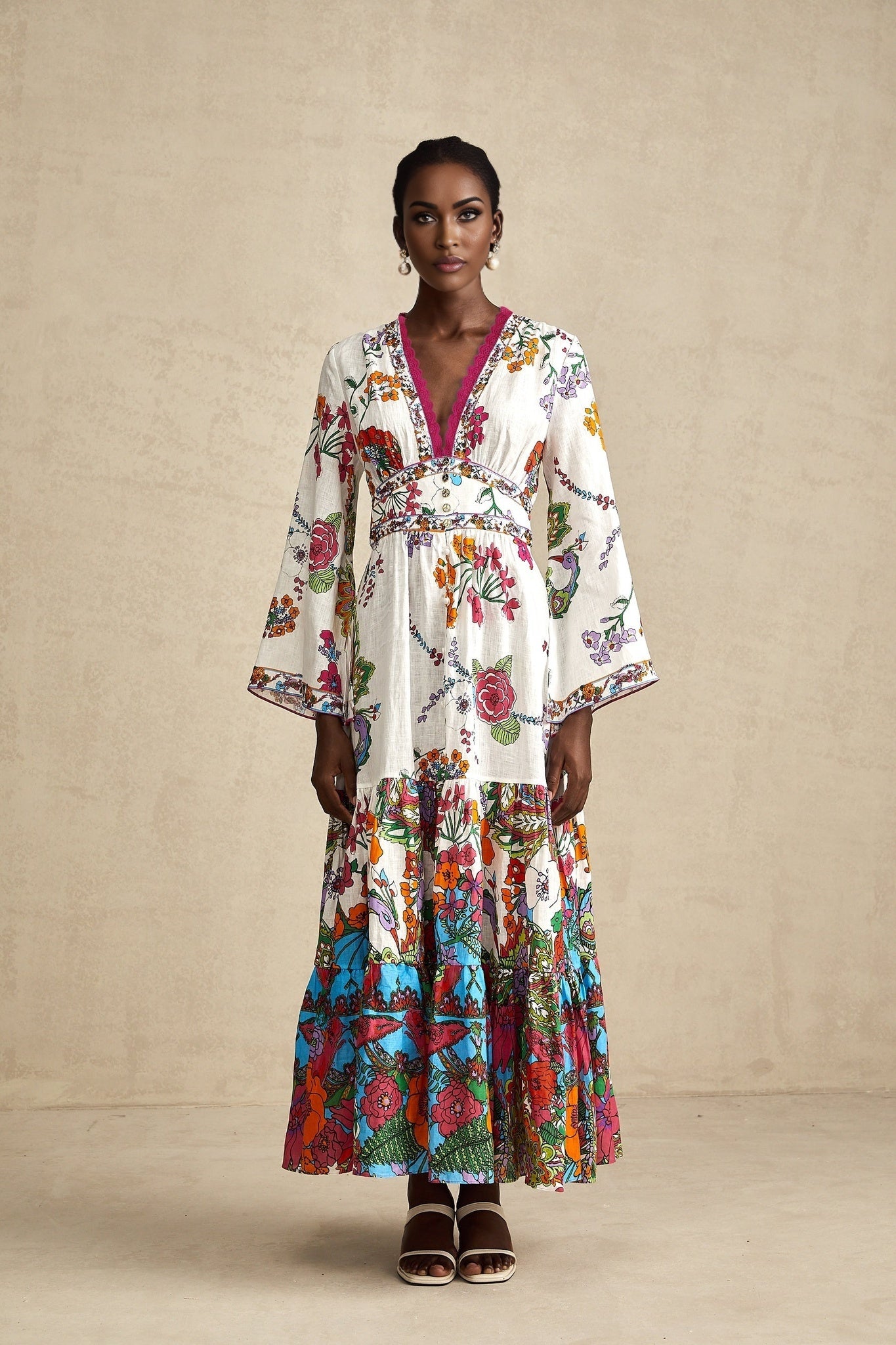 Woman wearing a floral print midi dress with V neckline featuring Helene design