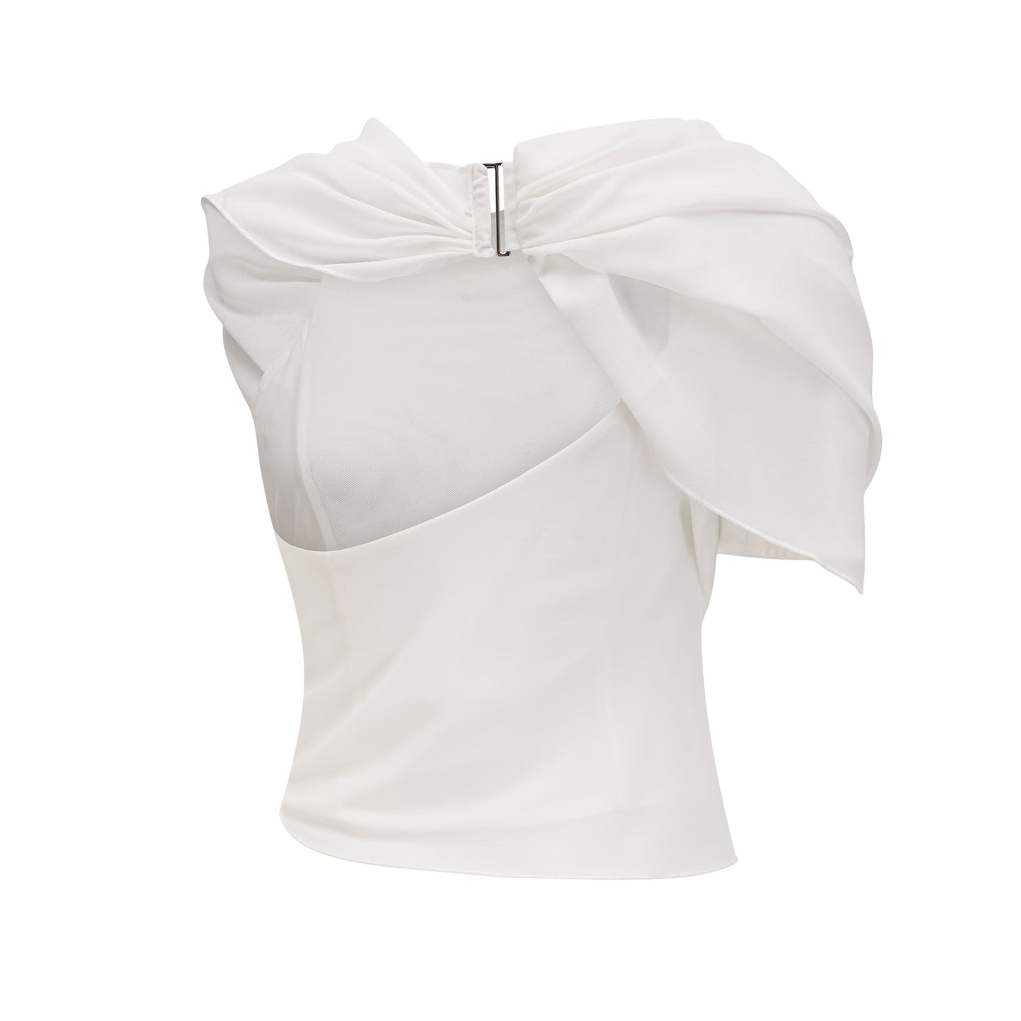 Woman wearing a flowing white chiffon blouse named Jeanne with loose sleeves and delicate fabric
