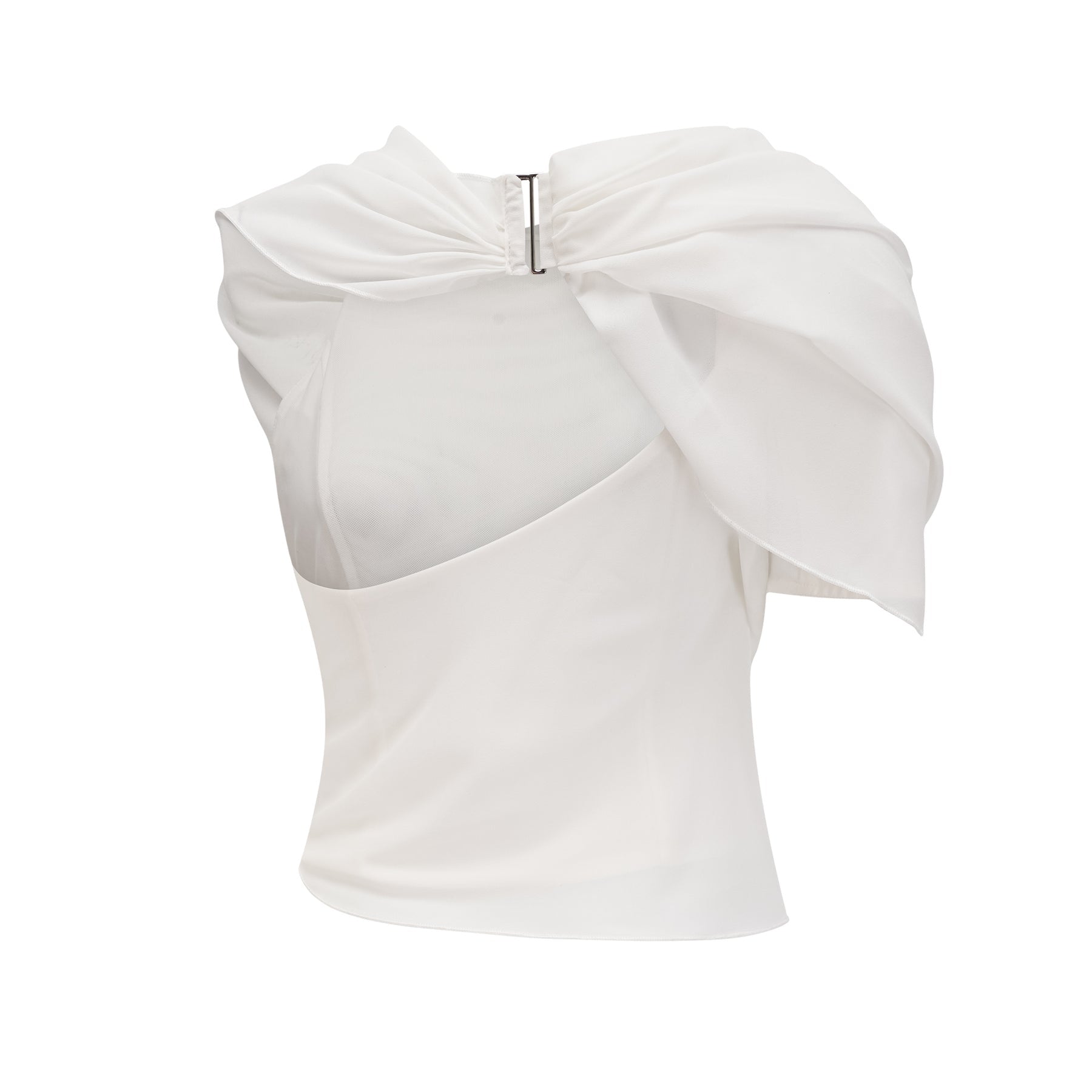 Woman wearing a flowing white chiffon blouse named Jeanne with loose sleeves and delicate fabric