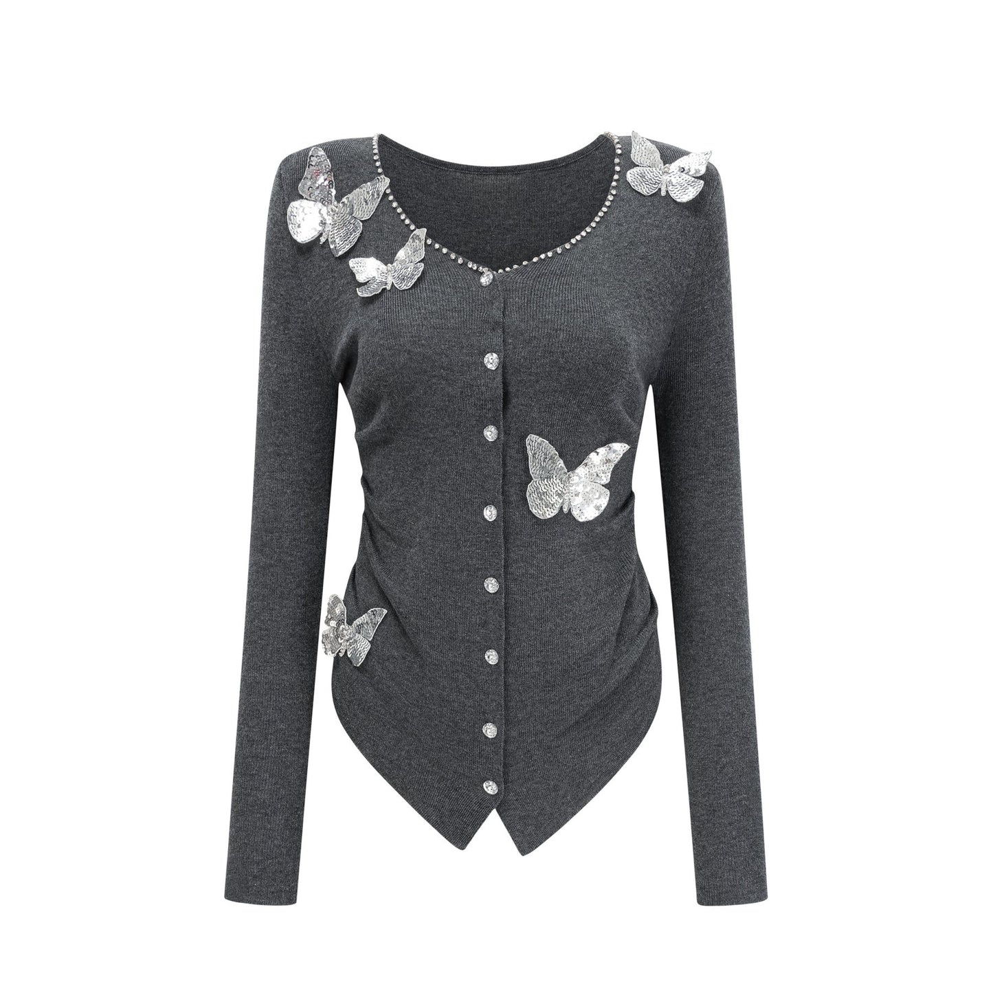 Woman wearing a grey cardigan with sequined butterfly designs on the front and sleeves