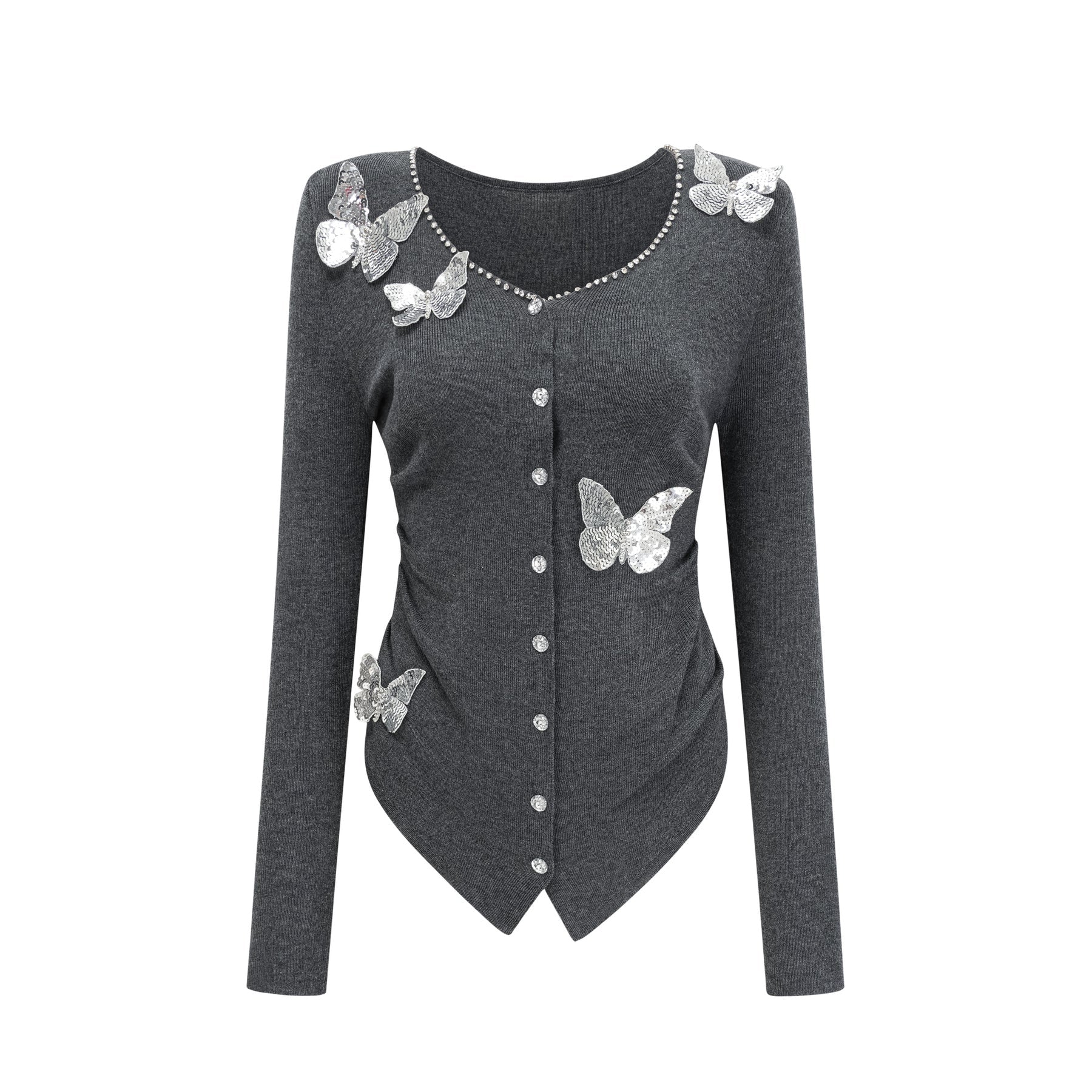 Woman wearing a grey cardigan with sequined butterfly designs on the front and sleeves