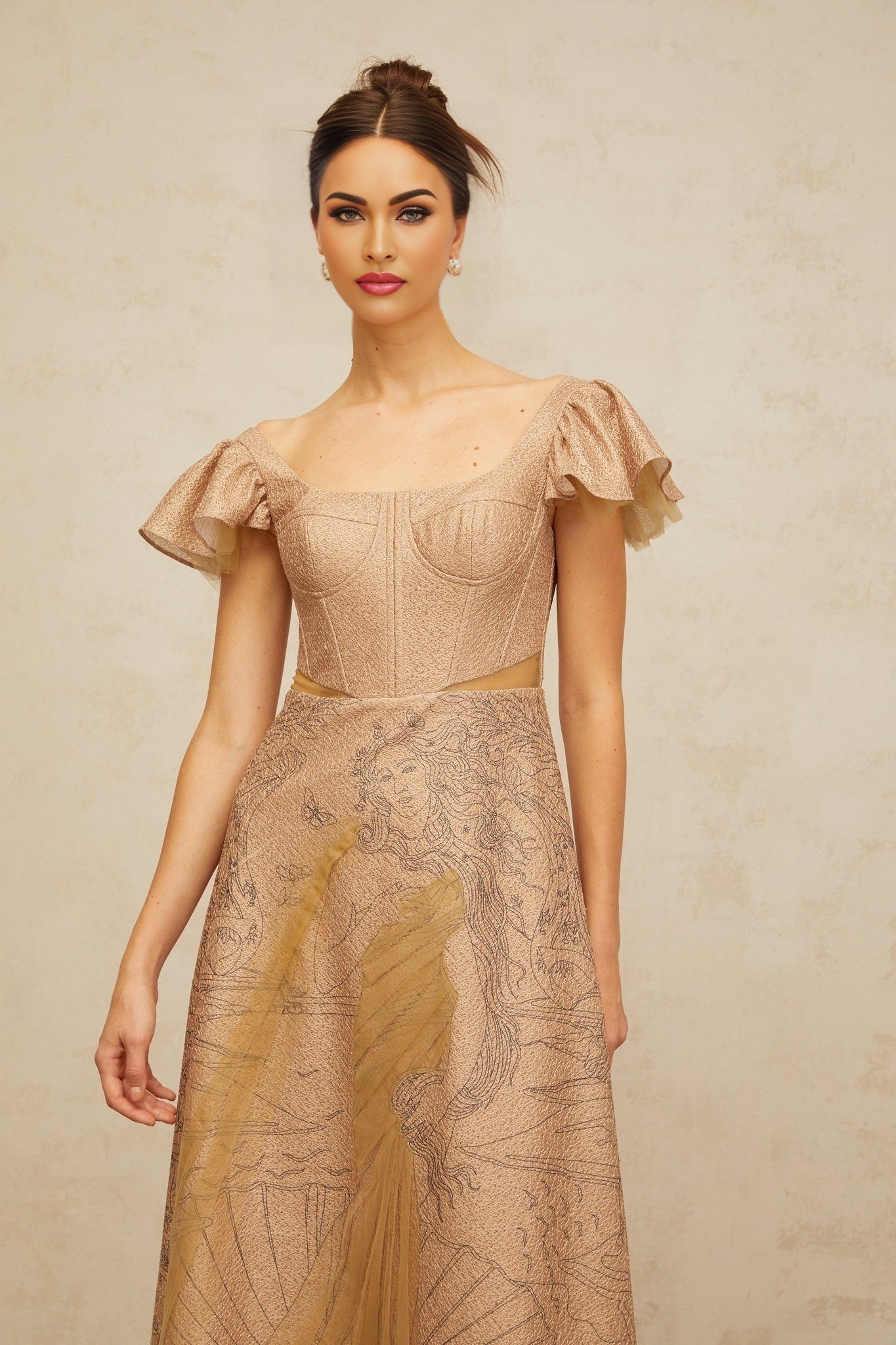 Woman wearing a khaki colored midi dress with flared skirt and graphic print design standing in casual pose