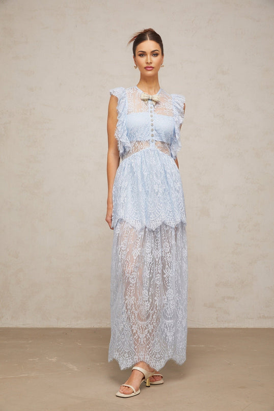 Woman wearing a long blue lace maxi dress with layered skirt and capucine neckline