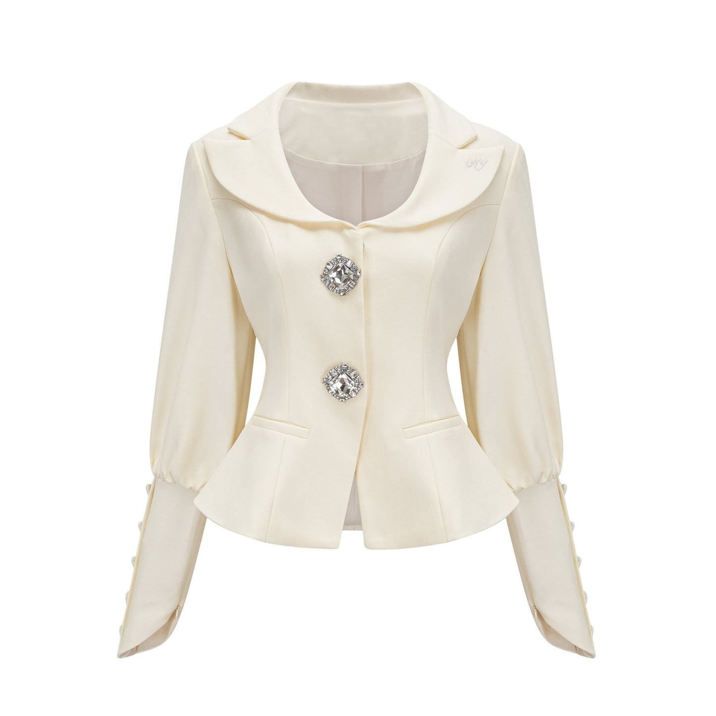 Woman wearing a matching jacket and shorts set embellished with crystal details The outfit has a glamorous and sparkly appearance