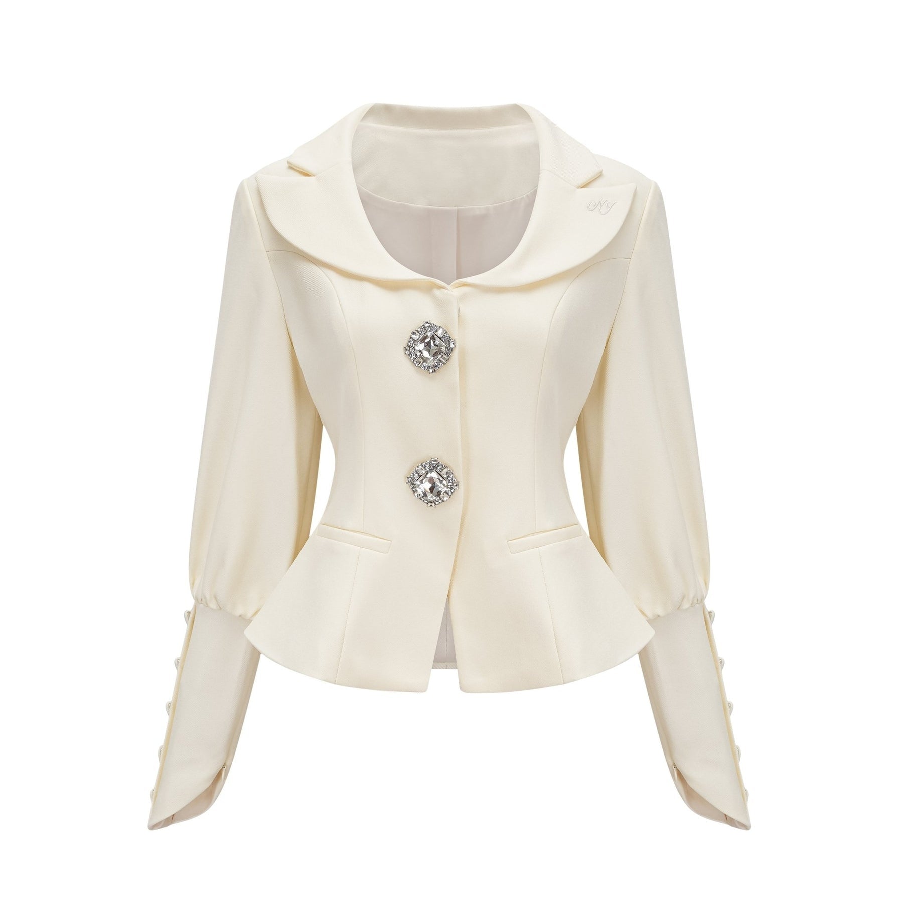 Woman wearing a matching jacket and shorts set embellished with crystal details The outfit has a glamorous and sparkly appearance