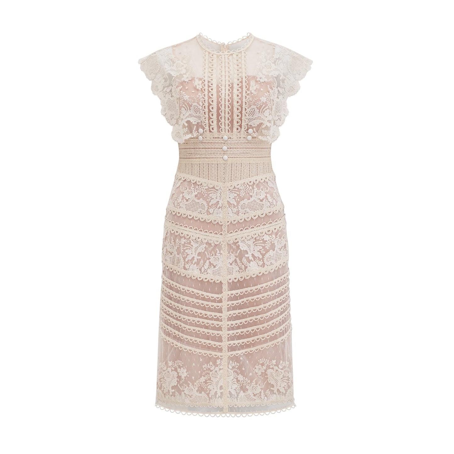 Woman wearing a neutralcolored midi dress with floral embroidery and lace details standing in a relaxed pose