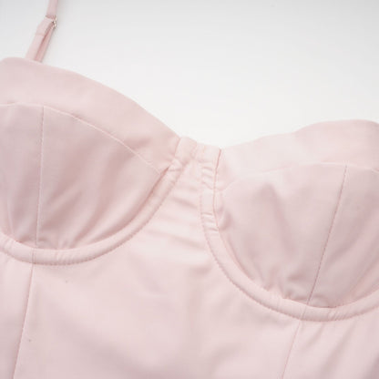 Pink midi dress with sleeveless bustier style delicate spaghetti straps pleated design and flared skirt Features two side inset pockets and rear zip fastening Made of 73% Polyester and 27% Viscose