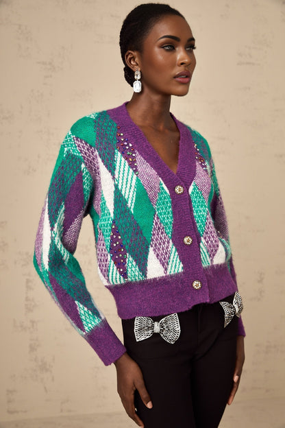 Woman wearing a purple knit top with argyle pattern design
