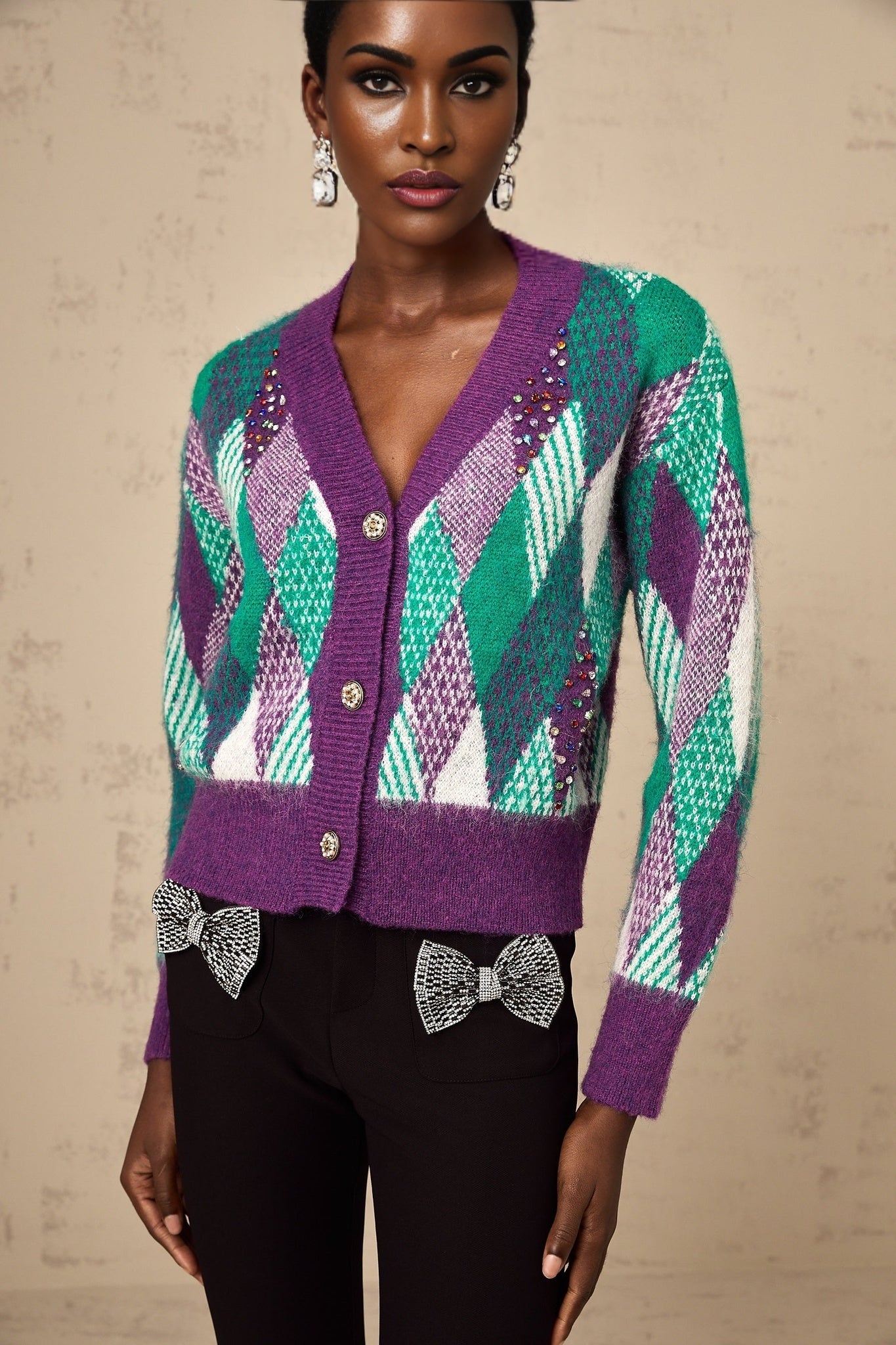 Woman wearing a purple knit top with argyle pattern