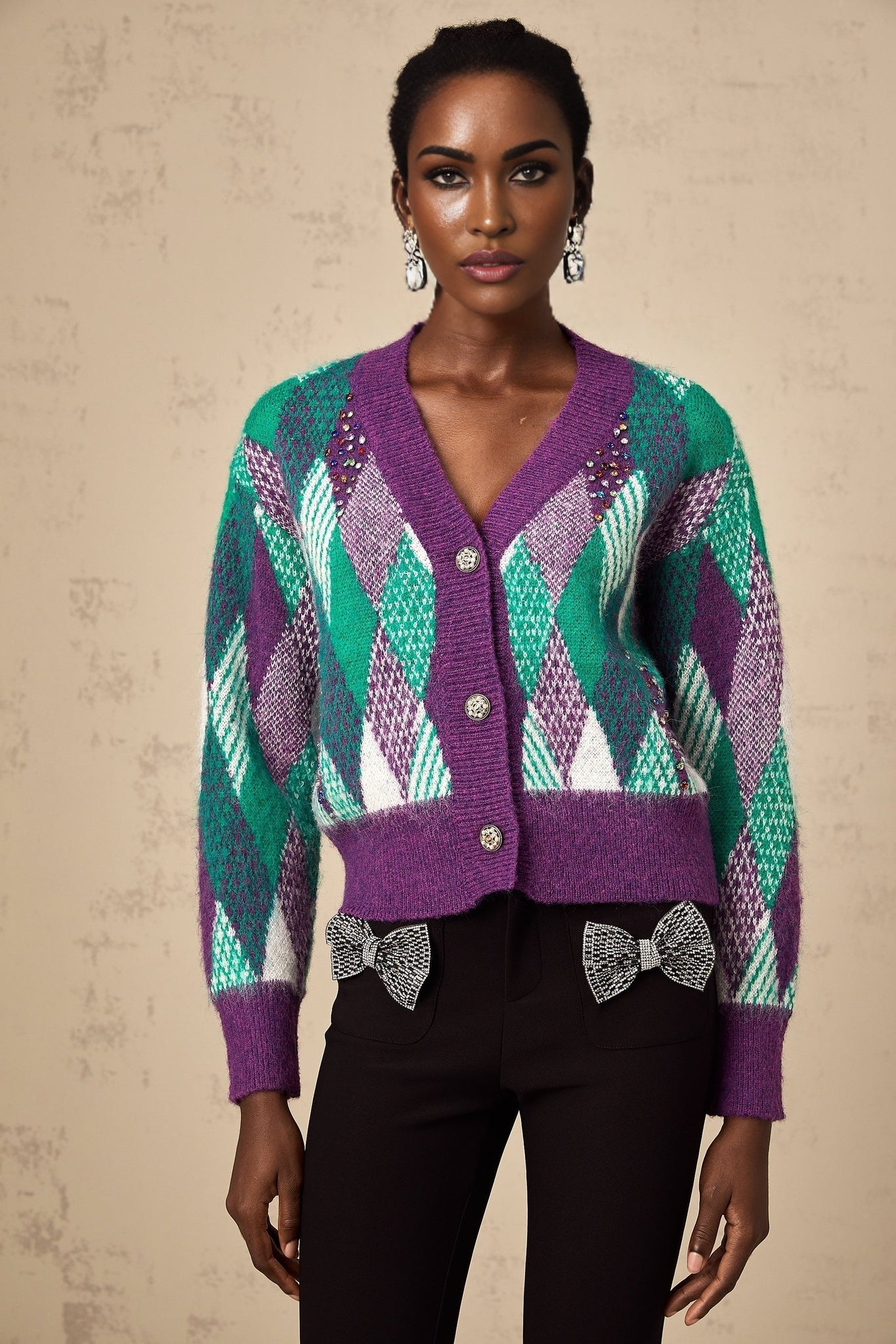 Woman wearing a purple knit top with argyle pattern