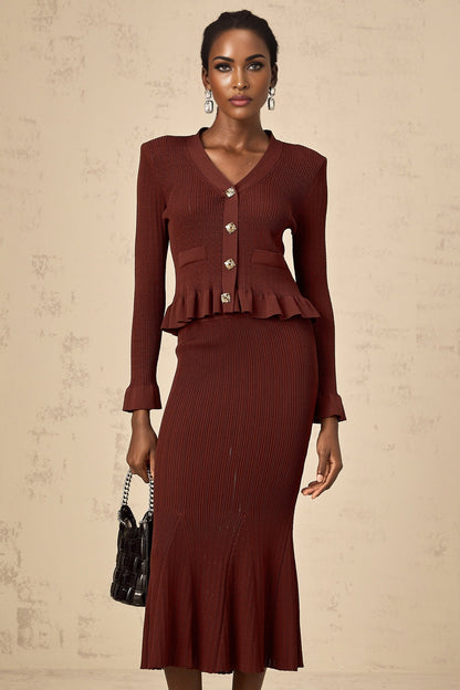 Woman wearing a red knit matching set consisting of a ruffled top and skirt