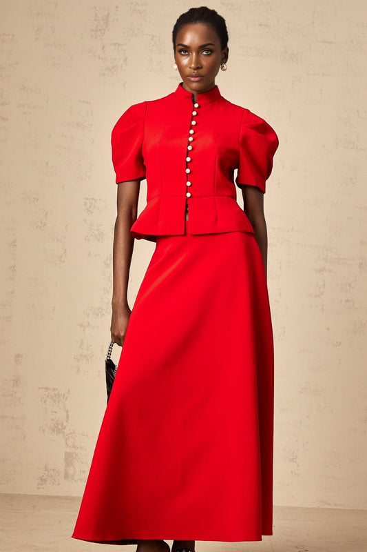 Woman wearing a red pleated blouse and matching skirt set Colette style outfit