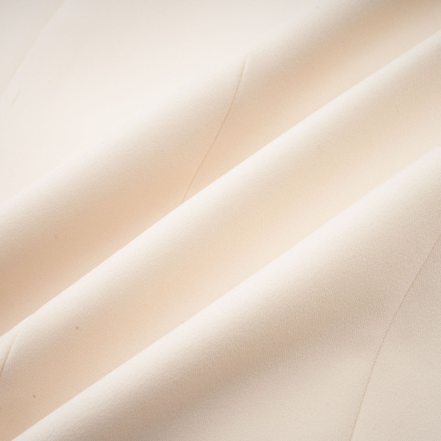 Woman wearing a shimmering blazer dress with sequin embellishments