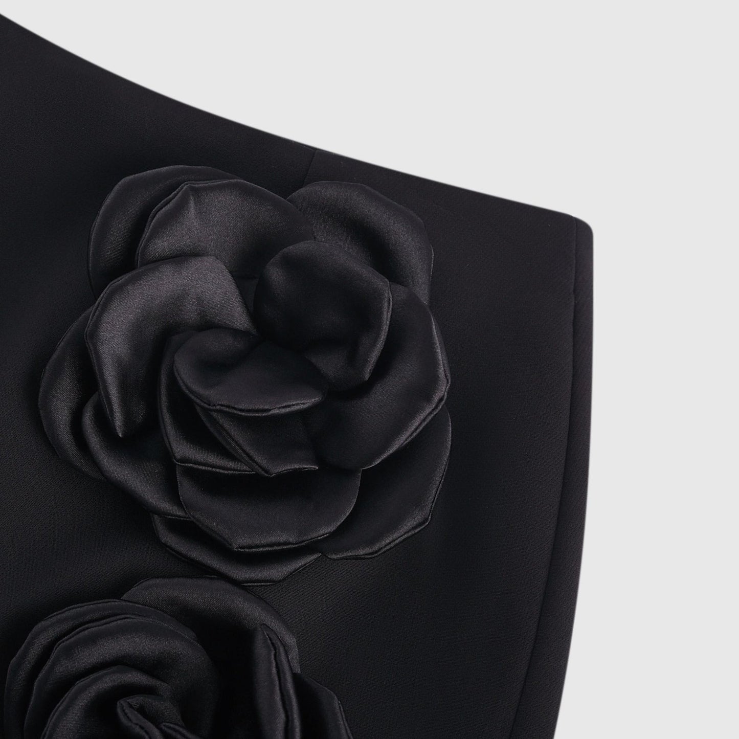 Jet black dress with fauxflower adornment side zip neat straight hem thighlength 100% Acetate fiber