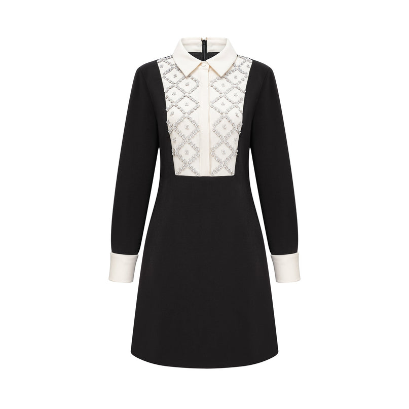 Woman wearing a short mini dress with contrasting colors and embellishments