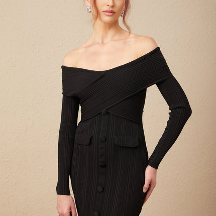 Woman wearing a short offshoulder dress with ribbed fabric texture in a fitted silhouette