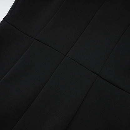 Black sleeveless dress with cutout design bowknot embellishment thighlength and rear zip closure Composed of 65% Viscose 35% Polyamide