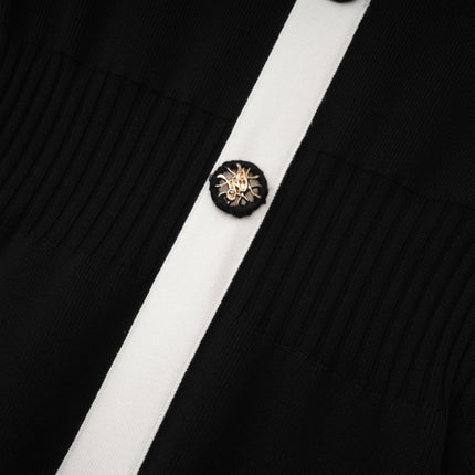 Woman wearing a short wool dress with color block design and ribbed texture in different shades