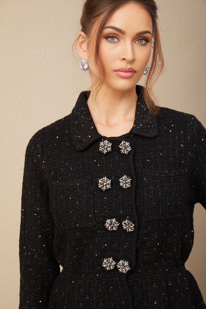 Woman wearing a sparkly sequined waffle knit jacket and matching skirt set in a stylish pose