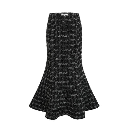 Woman wearing black and white checked tweed vest top and matching skirt set called Axelle