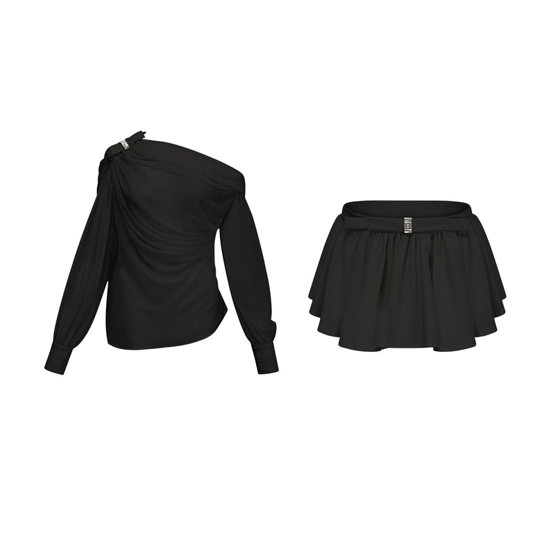 Woman wearing black Andrea asymmetric tulle blouse and matching skirt set