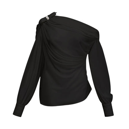 Woman wearing black asymmetric tulle blouse and matching skirt set
