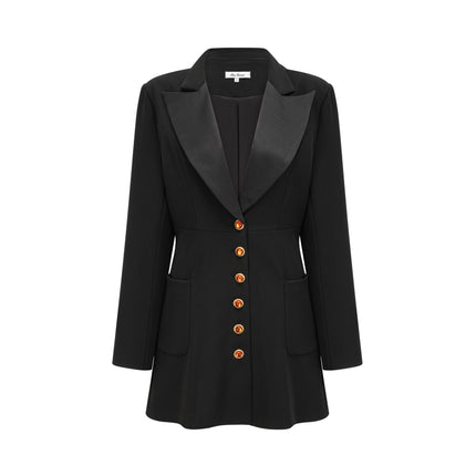 Woman wearing black blazer dress with single button closure and tailored fit