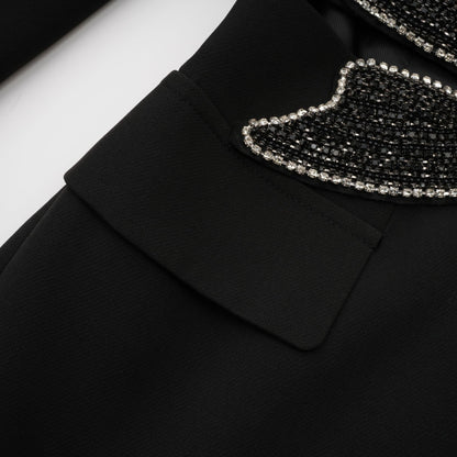 Woman wearing black blazer with bowknot detail and cutout design