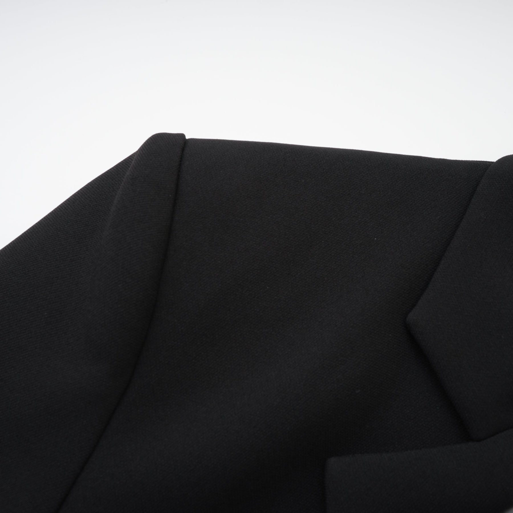 Black dress with long sleeves notched lapels scoop back buttoned cuffs fitted waistline crystal embellishment and front button fastening Made of 100% polyester