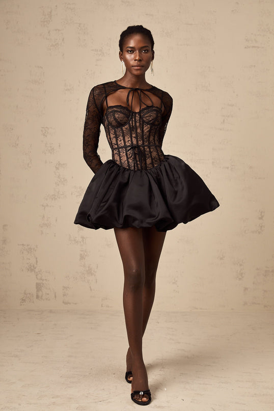 Woman wearing black floral lace sleeveless vest and matching dress set