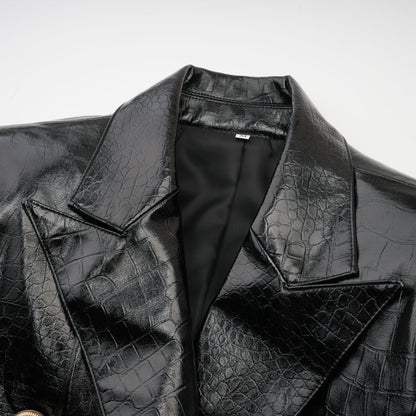 Woman wearing black leather jacket with cinched waist and zipper closure