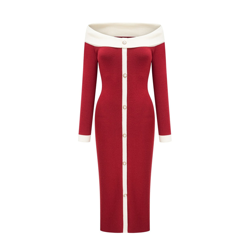 Woman wearing black offshoulder knit midi dress with fitted silhouette and long sleeves standing against plain background