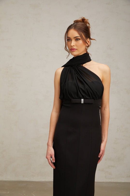 Woman wearing black one shoulder midi dress with draped detail