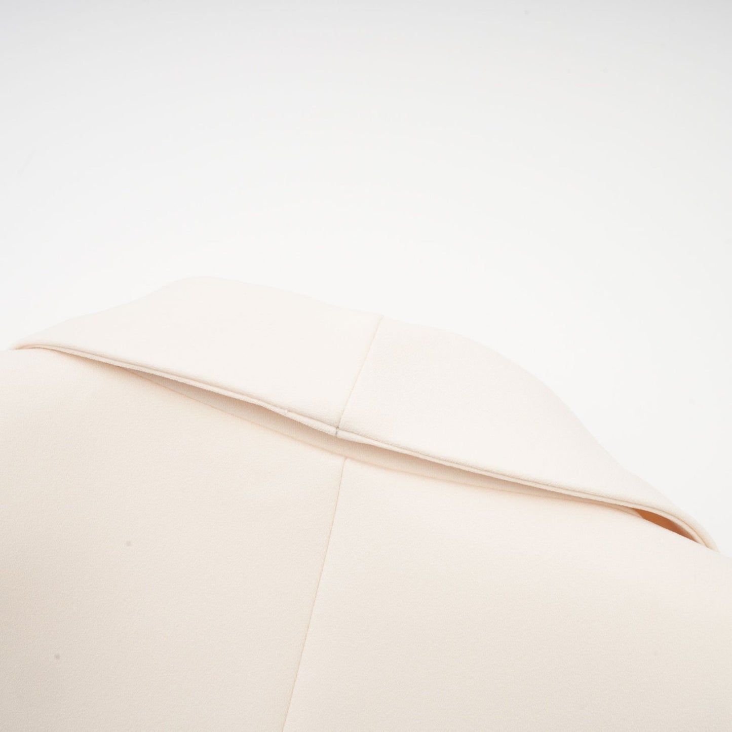 Woman wearing black sequined blazer dress with embellishments and long sleeves