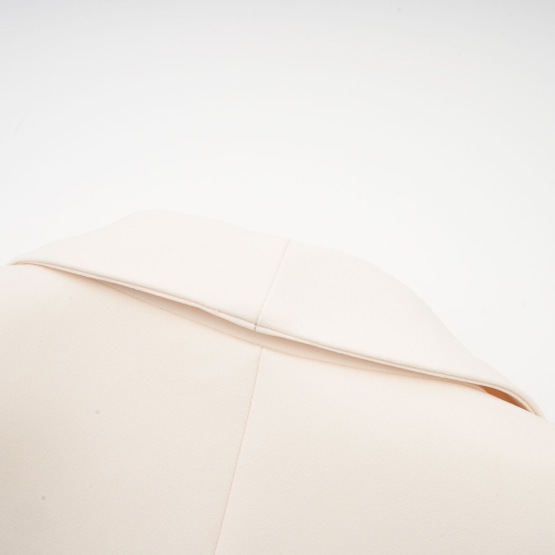 Woman wearing black sequined blazer dress with embellishments and long sleeves