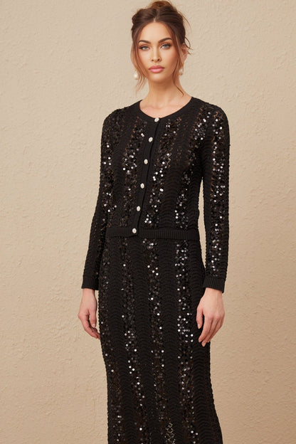 Woman wearing black sequined crochet knit cardigan and matching skirt set