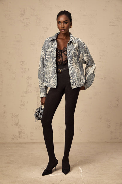 Woman wearing blue denim jacket with sequined flower embroidery design