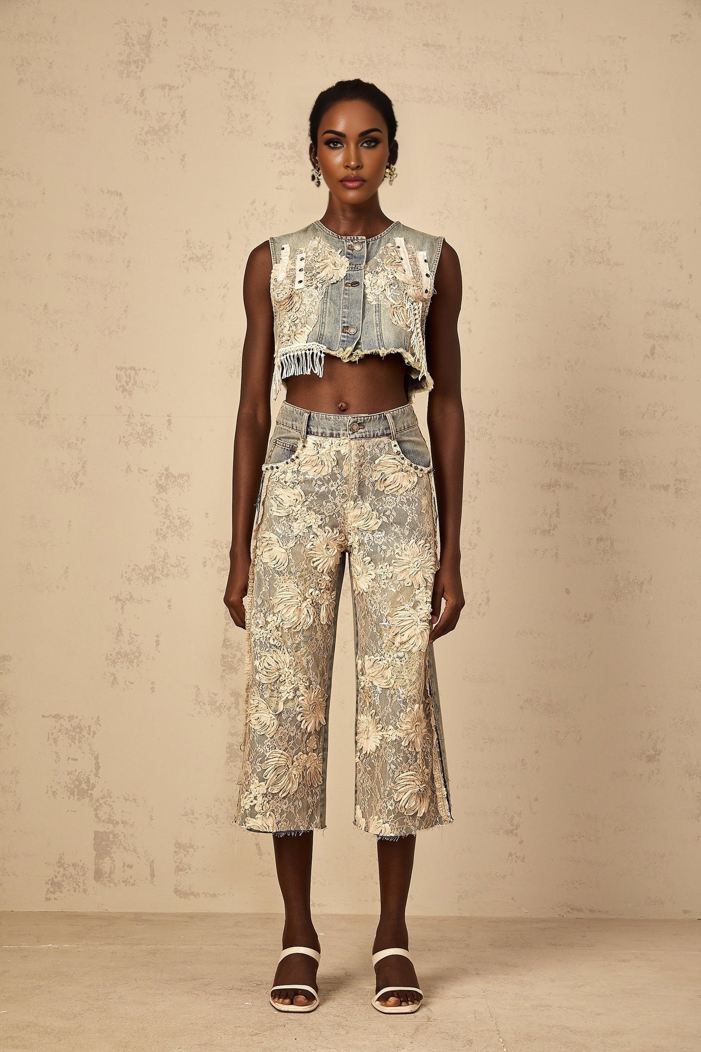 Woman wearing blue denim jeans with floral lace panels on the sides