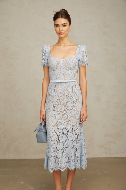 Woman wearing blue floral lace midi dress with boned bodice and delicate straps