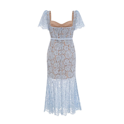 Woman wearing blue floral lace midi dress with boned bodice and fitted silhouette