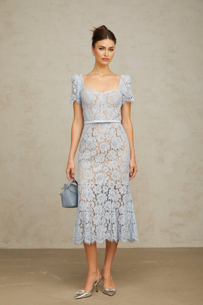 Woman wearing blue floral lace midi dress with boned bodice and sweetheart neckline