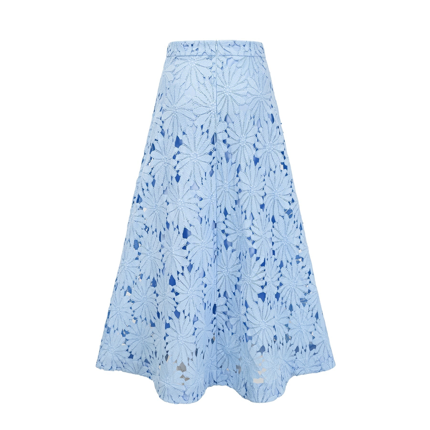 Woman wearing blue lace matching top and skirt set with intricate guipure pattern Audrey style outfit against plain background