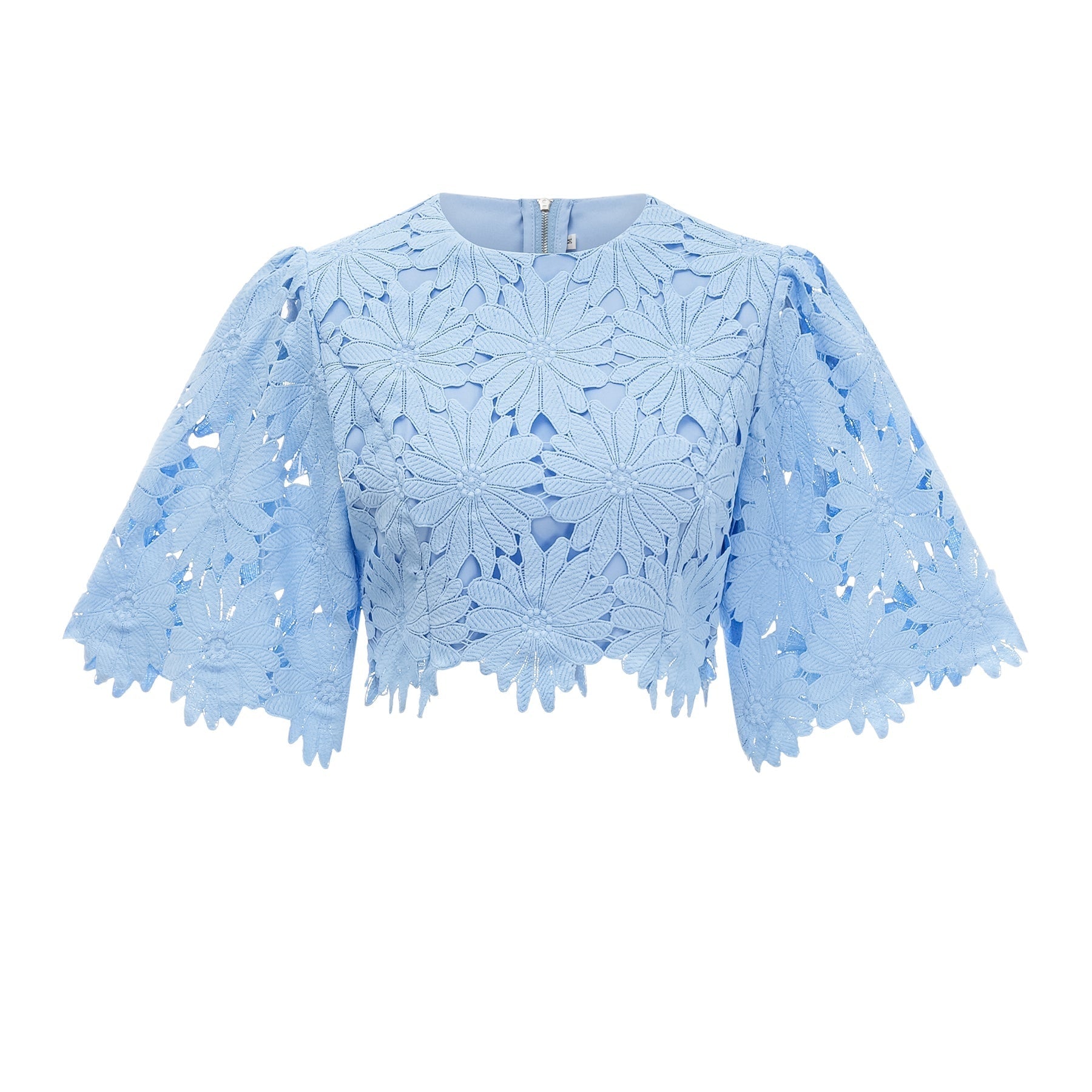Woman wearing blue lace top and matching skirt set called Audrey
