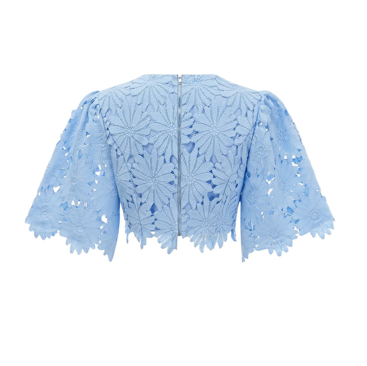 Woman wearing blue lace top and matching skirt set with guipure detailing named Audrey